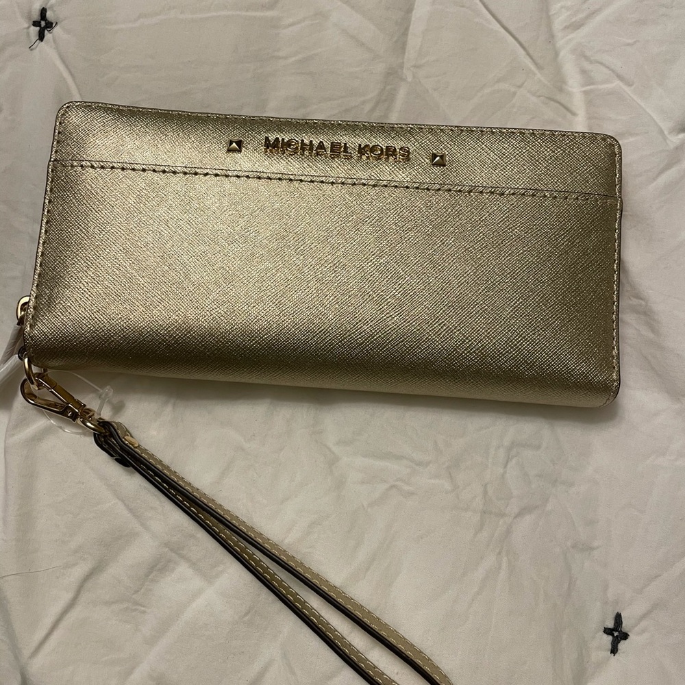 Brand new wallet with tags. A sparkly gold wallet